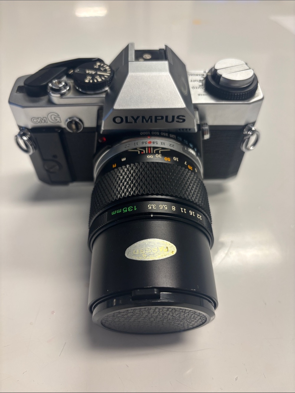 Olympus OM-G Film Camera + 135 mm lens.